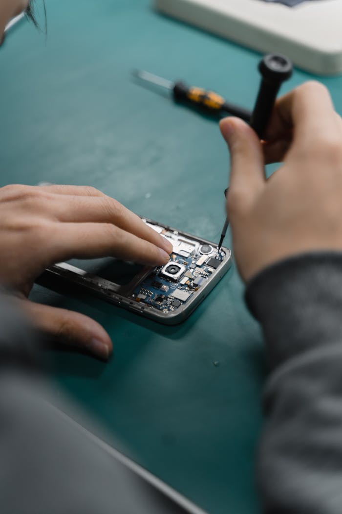 Person Holding Black Iphone 4